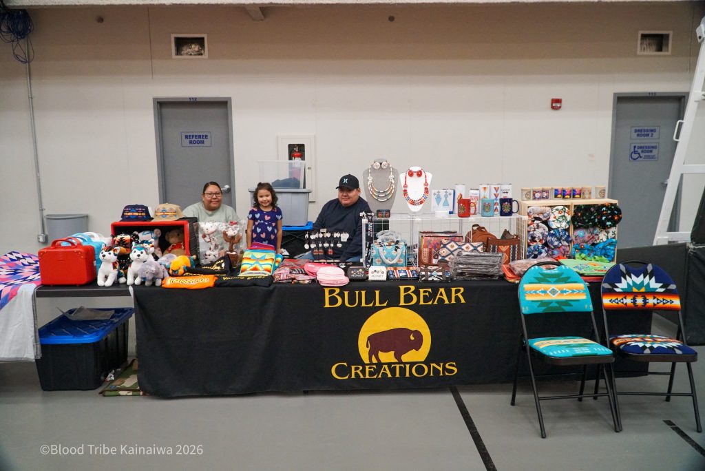 Nugget and Alexis Bull Bear pose at their vendor stand, Bull Bear Creations, at the Blood Tribe Economic Development’s Valentine’s Day Market at the Standoff Multi-Purpose Building on February 6, 2026. Photo credit Joey Sugai.